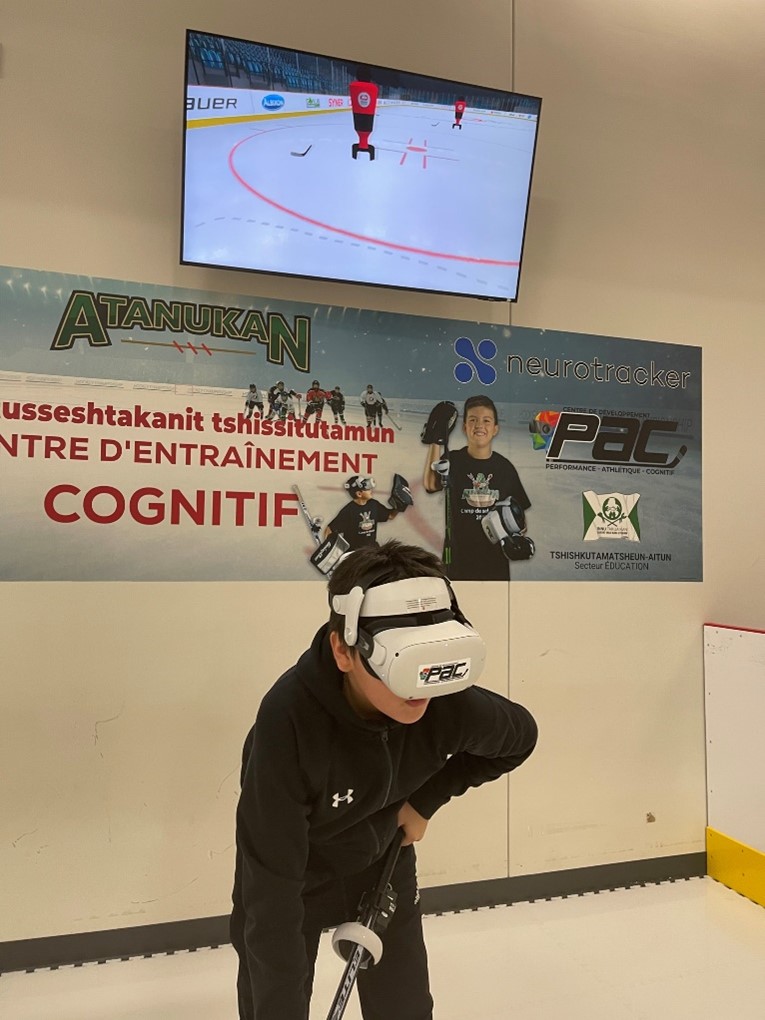 Youth using a virtual reality headset to practise hockey. This type of equipment is highly coveted by professional athletes.